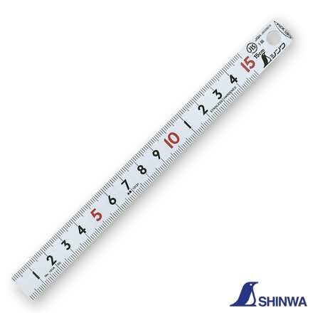 Shinwa 13131 ruler being picked up using the bent tapered end feature.
