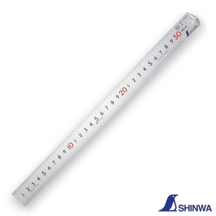 Shinwa 13134 ruler being picked up using the bent tapered end feature.