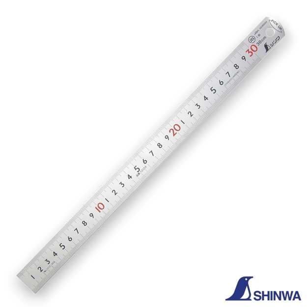Shinwa 13134 ruler being picked up using the bent tapered end feature.