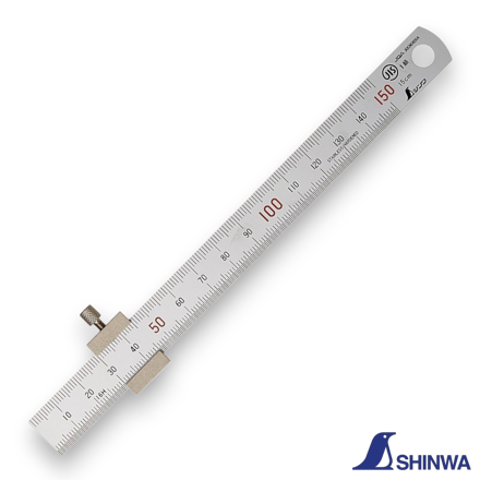 Shinwa 76751 ruler with stopper being used to measure the depth of a hole.