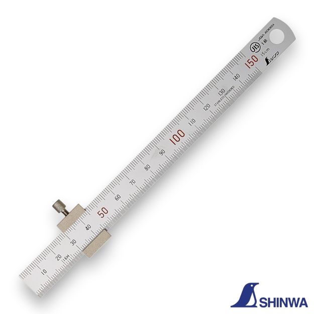 Shinwa 76751 ruler with stopper being used to measure the depth of a hole.