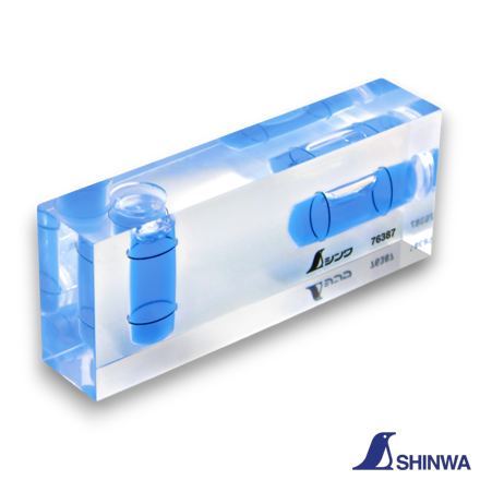 Shinwa 76387 Revo Clear Cube showing two-direction bubble vials on a transparent acrylic body