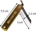 Macro view of the Warikomi laminated steel blade texture and brass handle stamping.