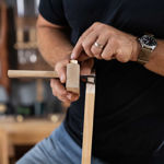 Side view of the 120mm white oak fence and brass locking screw on a Japanese marking gauge.