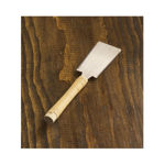 Close-up of the micro-fine crosscut and rip teeth on the 60mm Japanese Ryoba blade.